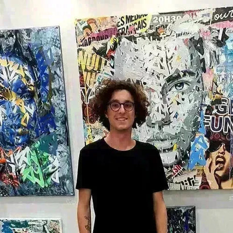 Young man with curly hair and glasses in black t-shirt from Yba collection