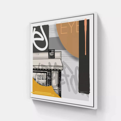 A white frame with a black and yellow painting on it