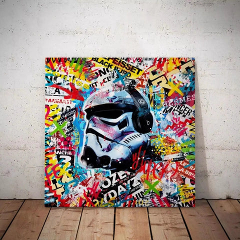 A painting of a storm trooper helmet on a wooden floor