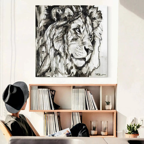 A black and white lion painting on a wall