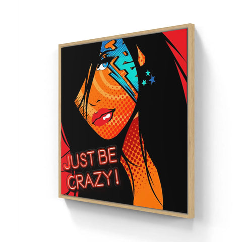 A framed print of a woman with a red background and the words just crazy