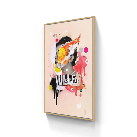 Framed abstract artwork featuring colorful shapes, splatters, and text elements on a light background.