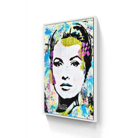 A painting of a woman’s face on a white wall