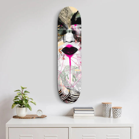 Artistic skateboard deck featuring abstract pink lips and monochromatic geometric patterns.