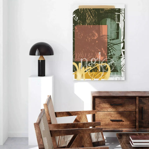 A dining table with a wooden chair and a painting on the wall