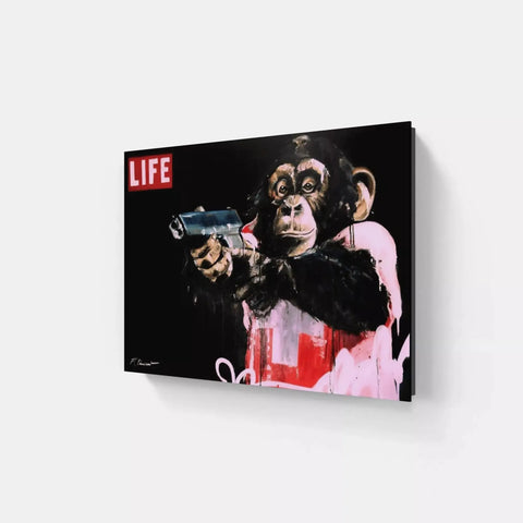 A monkey with a gun in its hand canvas print