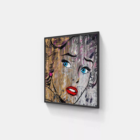 A painting of a woman’s face on a wall