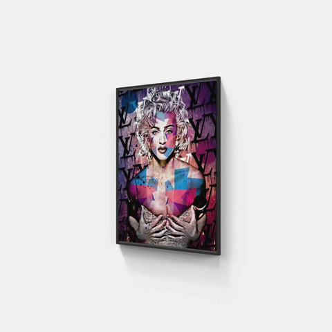 A framed print of a woman with a colorful face