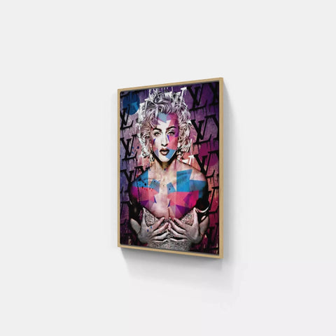 A framed print of a woman with a colorful face