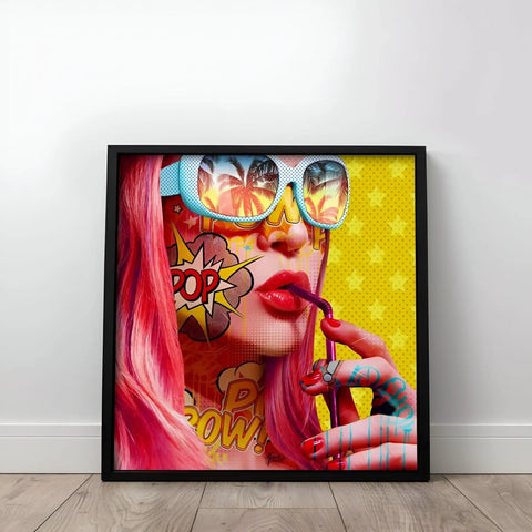 A framed print of a woman with pink hair and sunglasses