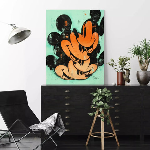 A mickey mouse painting on a wall in a living room