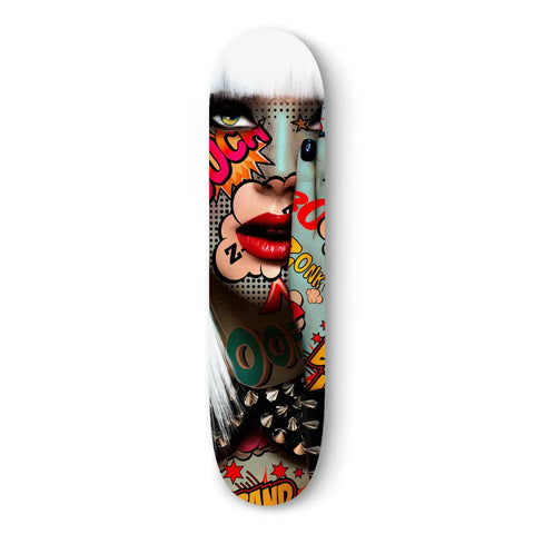 Skateboard deck featuring pop art-style graphic design with vibrant colors and comic book elements.