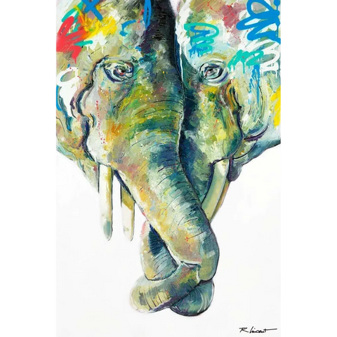 An elephant with colorful paint on it’s face