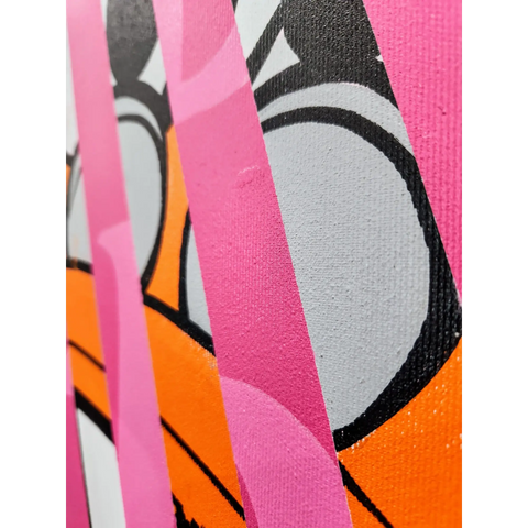 A close up of a pink and orange abstract painting