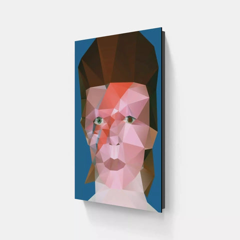 A pink and blue geometric face on a white wall